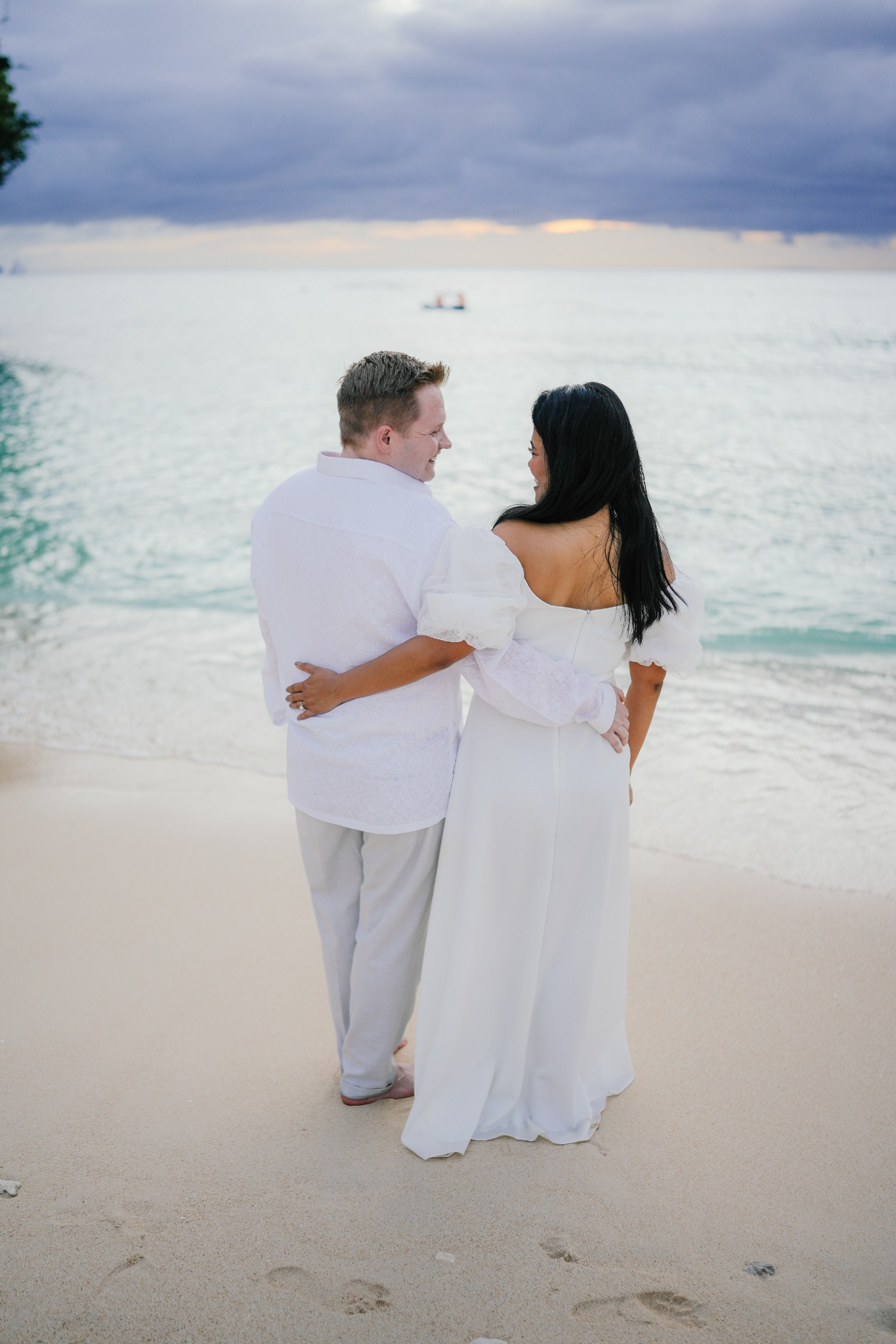 Jenny and Elliot walking on the beach